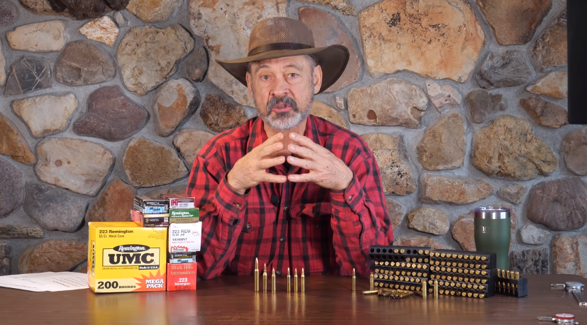 old man with different types of bullets on a table